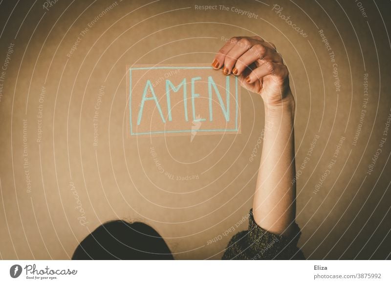 A woman holds a sign saying Amen. Concept praying, preaching and church. Church Belief Prayer Sermon Holy religion Church service amen say amen