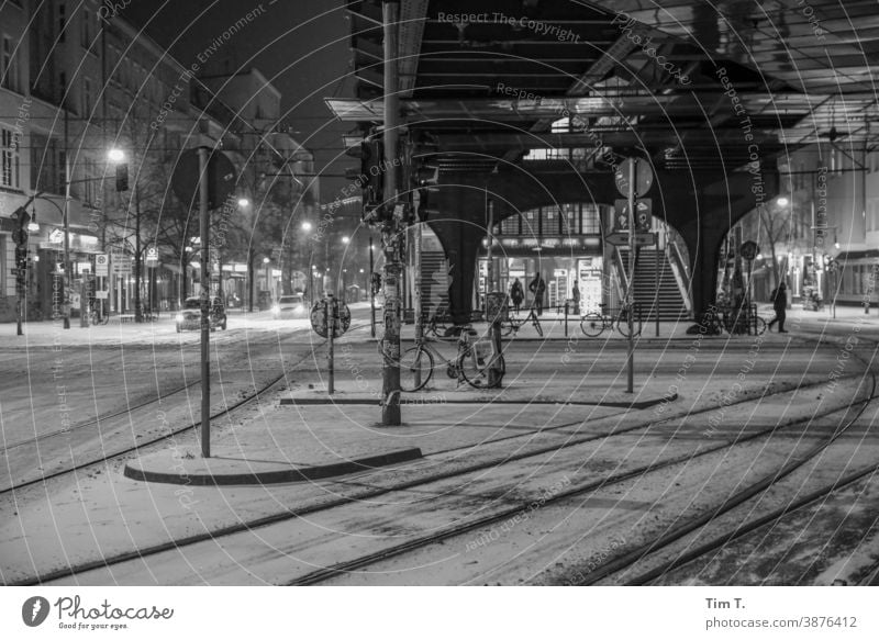 At night at the snowy crossing Schönhauser Allee at the corner of Eberswalder Berlin Prenzlauer Berg Winter Snow Night Train station Black & white photo