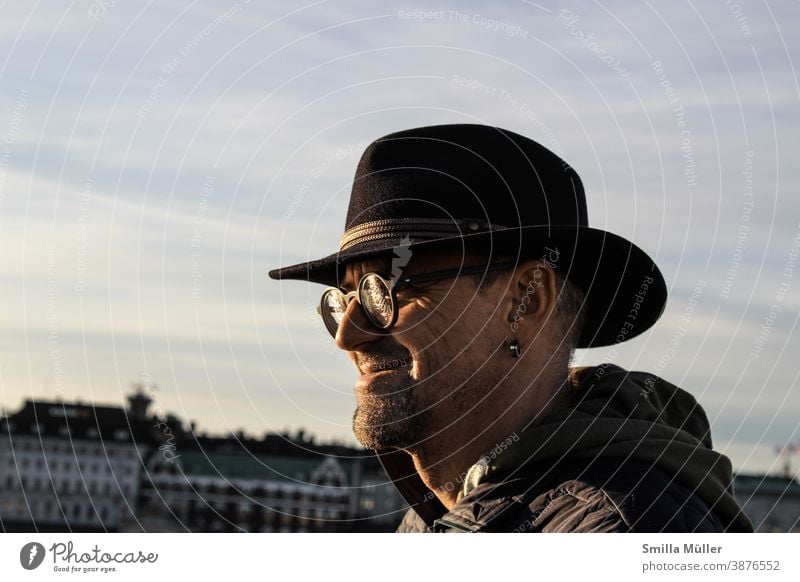 Smiling man with hat and glasses Hat Eyeglasses Person wearing glasses Man Colour photo laughing Earring Chin Designer stubble