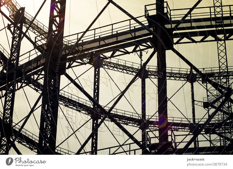 Detail of the Gasometer in backlight Architecture Schöneberg Historic Construction Structures and shapes Twilight Sunlight Contrast Silhouette Back-light