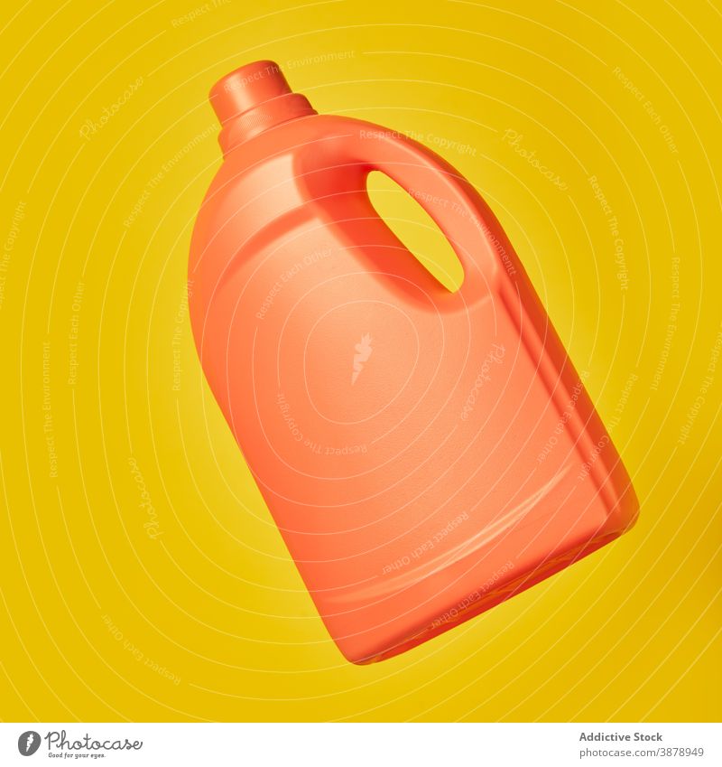 Plastic bottle from detergent on yellow background plastic cleanse hygiene container liquid product household housework studio vivid vibrant color bright