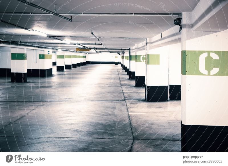 Underground car park with coloured letter identification Underground garage Garage Parking garage Concrete Parking lot Parking level Wall (building) Asphalt