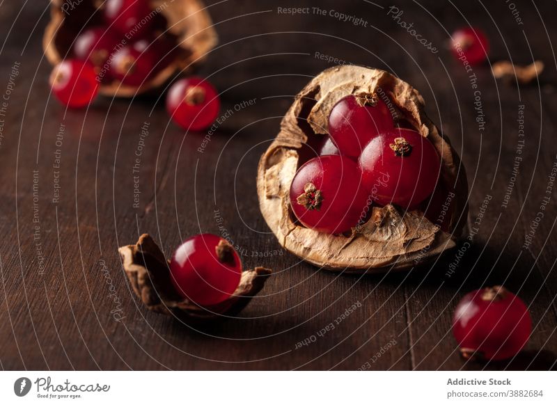 Pomegranate seeds and walnut shell pomegranate fruit food fresh natural vitamin concept ripe red healthy organic nutrition raw vegan ingredient colorful edible