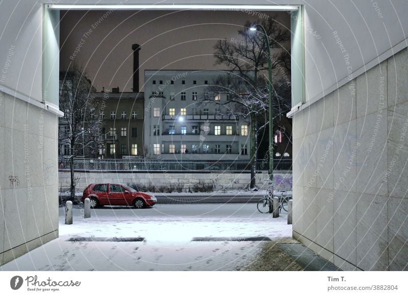 Winter in Schönhauser Allee . It is night . Berlin Night Avenue city Prenzlauer Berg Downtown Exterior shot car passage Goal Capital city Town Old town Deserted