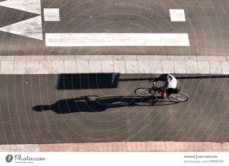 cyclist on the street in Bilbao city, Spain biker bicycle transportation cycling biking exercise ride speed fast blur blurred motion movement defocused road