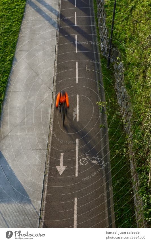 cyclist on the street in Bilbao city, Spain biker bicycle transportation cycling biking exercise ride speed fast blur blurred motion movement defocused road