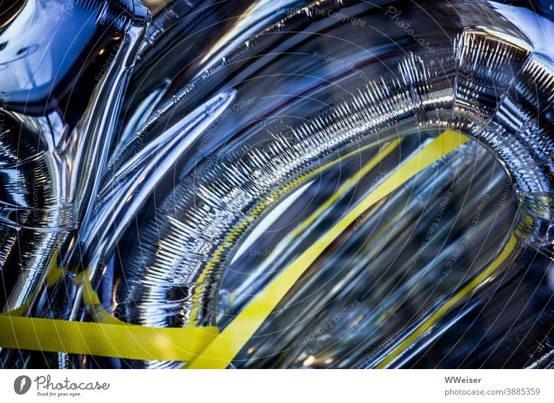 Colour contrast, material and light in the smart shop window of a department store Packing film Metal tapes Band Blue Yellow Glittering metallic Abstract Light