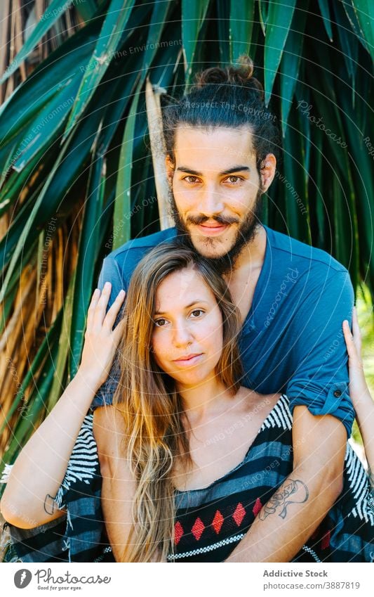 Tender couple hugging in nature romantic gentle touch tender love relationship together park multiracial multiethnic diverse tropical fondness bonding enjoy