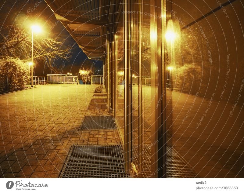 Store line Night shot Loneliness Night life Long exposure block of flats Street lighting Exterior shot Lighting Lamp post Artificial light urban Evening