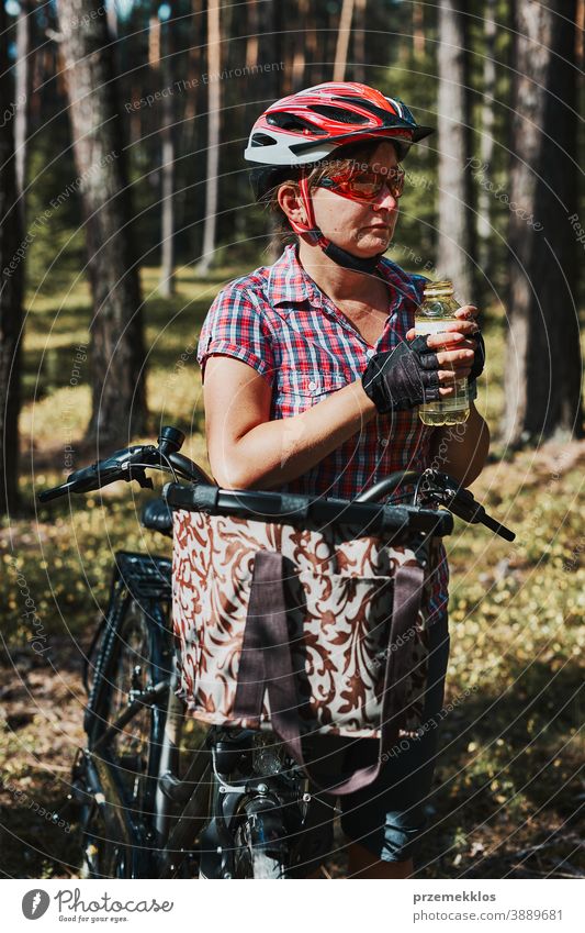 Active woman spending free summer vacation time on a bicycle trip in a forest joy freedom fall recreation adventure enjoy forest landscape forest trees