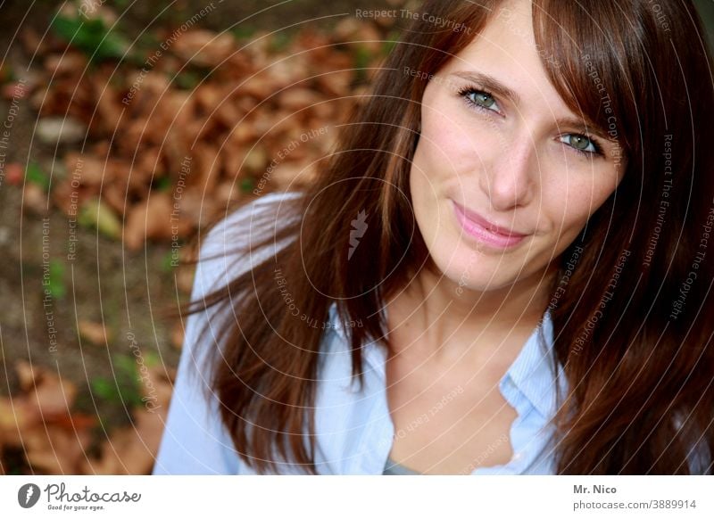 autumn glance Upward Bird's-eye view Looking into the camera look up Long-haired Hair and hairstyles Smiling pretty Happy Face Emanation Delightful naturally