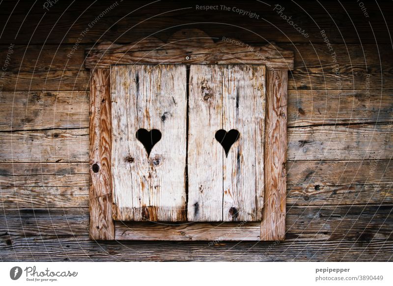 old wooden hut with closed heart shutters Wooden hut Hut Huts hut fun Après ski Winter Cold Mountain Winter vacation Alps Vacation & Travel Deserted Tourism