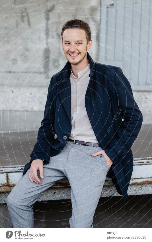 young man, business, outdoor masculine more adult Upper body arms folded Young man Man Friendliness Smiling Positive Impish Looking into the camera Business