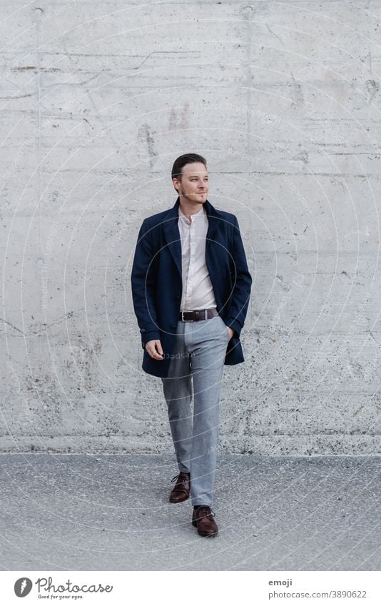 young man, business, outside in front of concrete wall masculine more adult Young man Man Friendliness Smiling Business Businessman Happiness Concrete