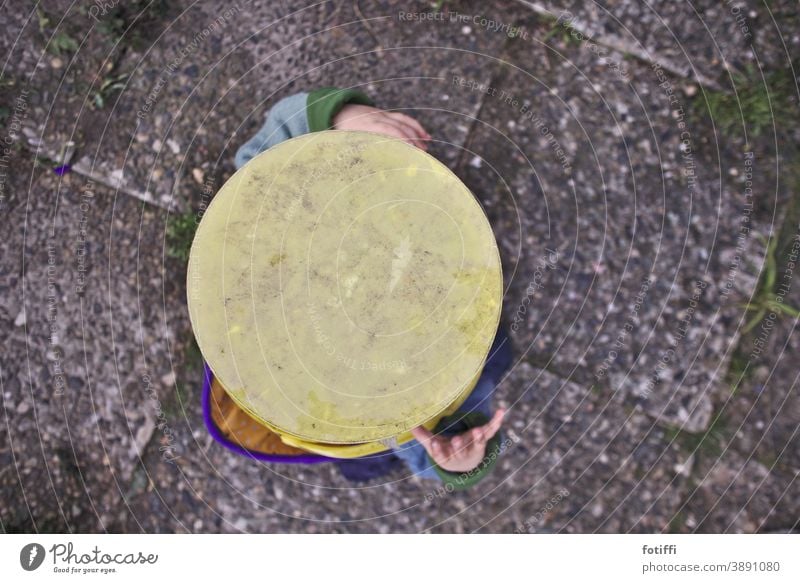 Stick your head in the bucket Child Toddler Hide play hide and seek Playing Joy Infancy 1 - 3 years Happiness Bucket from on high washed concrete Yellow amused