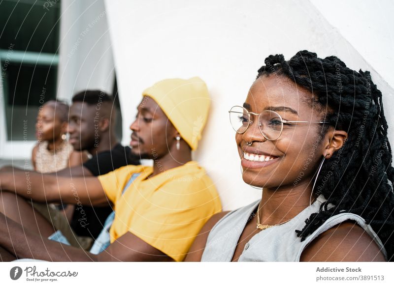 Company of young black people on street chill friend company together cool urban unity trendy ethnic african american building city gather weekend sit