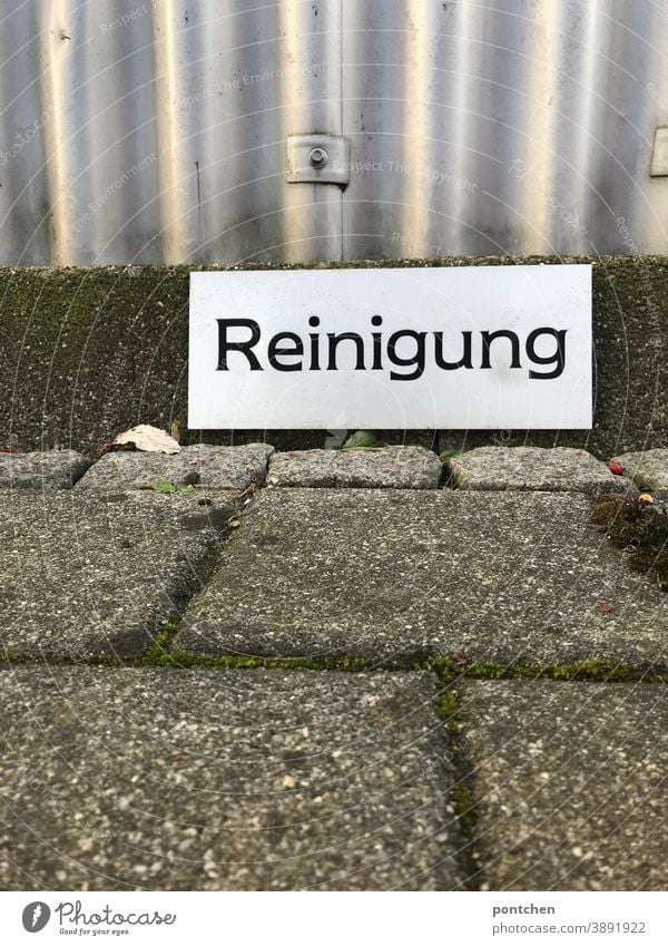 There's a sign saying "Cleanse. Marking for a parking space cleaning cleaning service Parking lot mark keep Signs and labeling Characters Clue Transport