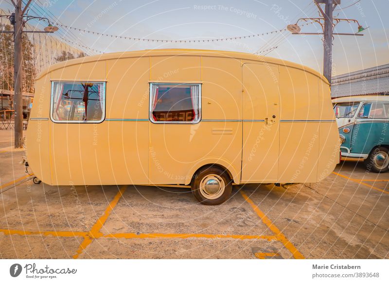 Yellow vintage RV, showing concept of travel and alternative lifestyle road trip yellow motorhome freedom motor home mobile home rv living transportation rustic