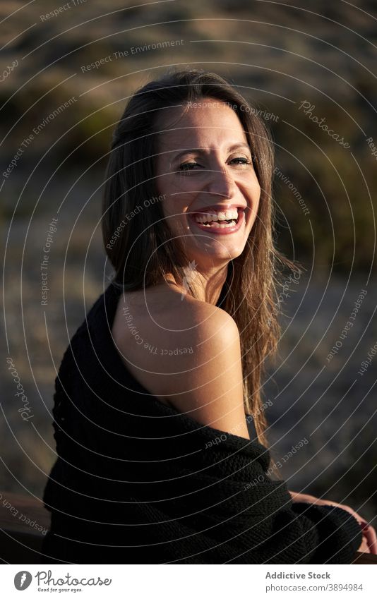 Tender woman on boardwalk on beach sweater fence promenade calm serene alone beautiful recreation casual rest tranquil style charming leisure female relax