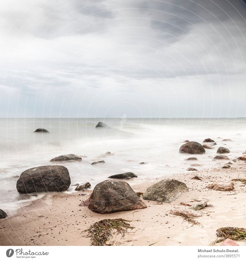 Rocks on the sandy beach Baltic Sea baltic Ocean sea Lake wave woge Water water Sand Beach White white Blue blue Green green Sky sky cloud tranquillity calm