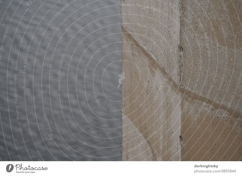 Concrete pillar with corner in beige and grey shades against a background of water piers Exterior shot Architecture Colour photo Bridge Wall (building) Deserted