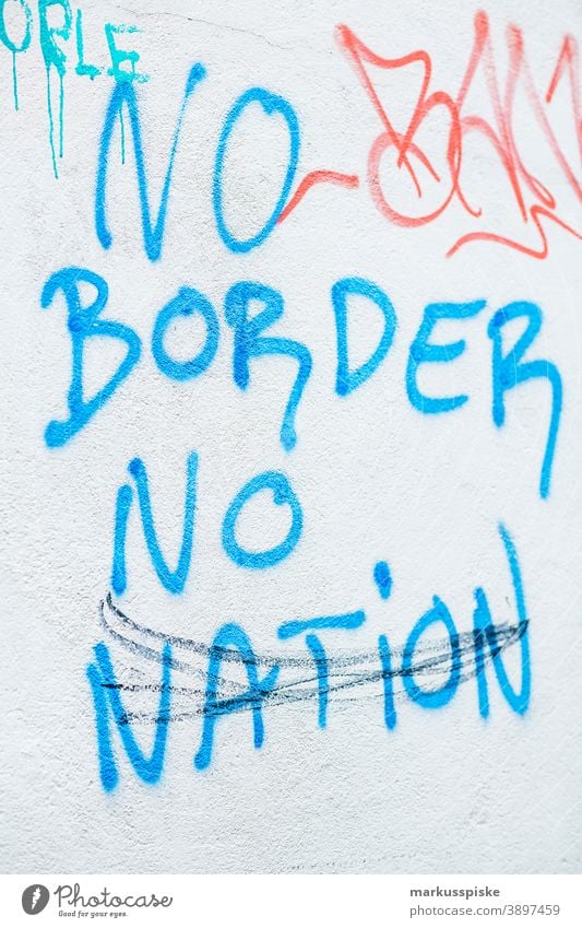 Graffiti No Border No Nation abstract art bonnet city close up colorful comic creative decal dispatch embassy font graffiti hope horizontal label lamp lantern