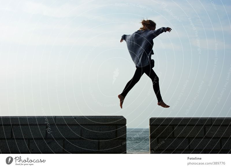 "I can fly!" cries the girl, spreading her arms and leaping over the gap in the wall Human being Feminine Child Girl Infancy Body Head Arm Hand Fingers Legs