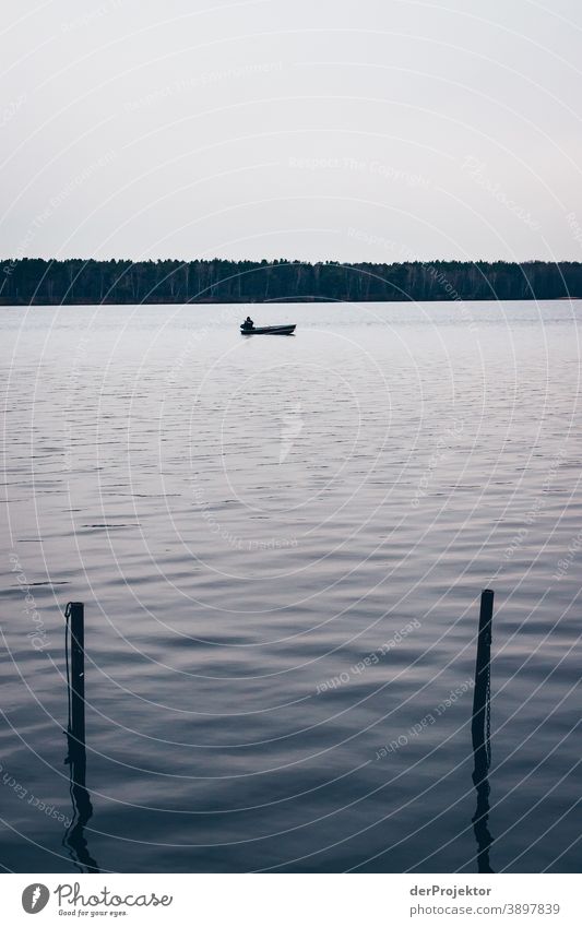 Angler on a lake in Brandenburg Grief Goodbye Subdued colour Contrast Copy Space bottom Copy Space top Copy Space left Copy Space right Copy Space middle