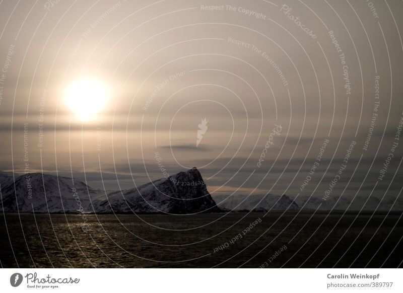 North Cap. Landscape Water Sky Sunlight Winter Wind Gale Ice Frost Snow Rock Mountain Snowcapped peak Dark Cold Blue Yellow Gold Gray White North Cape Norway