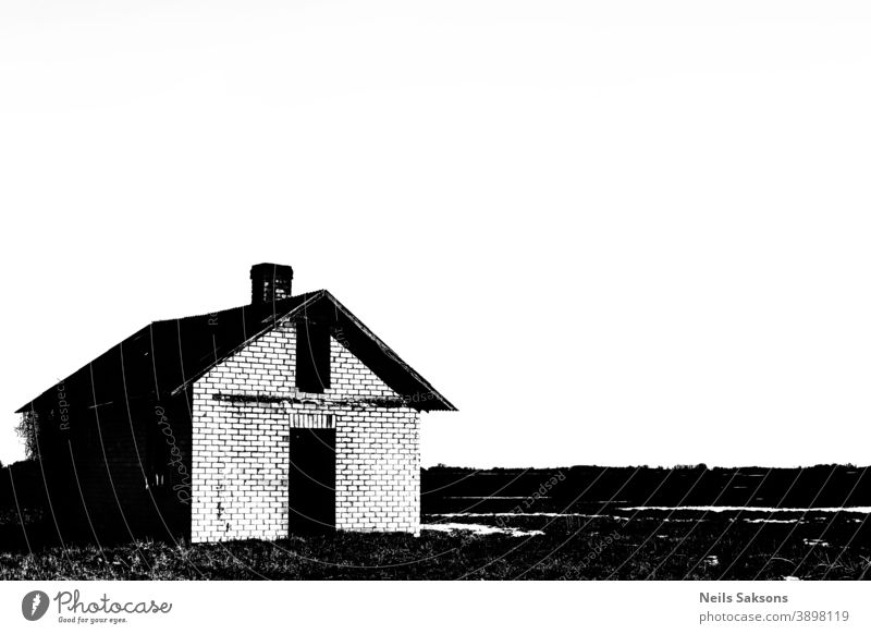 small abandoned house in field, high contrast black and white, copy space Abandoned architecture broken building country countryside day decrepit derelict