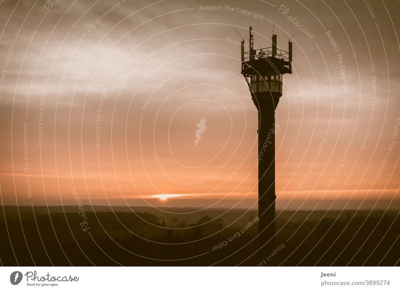 Sunset on a foggy horizon with a fire watch tower in the foreground Fog Red Orange Fire watch tower Fire station Fire department Forest fire