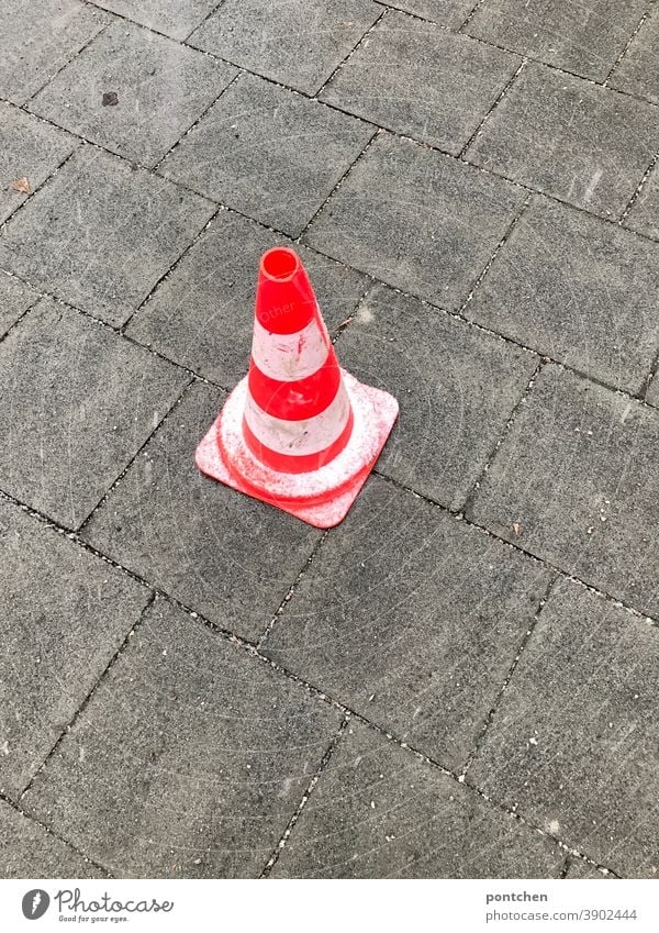 Accident. A warning traffic cone is on wet ground. traffic cone, traffic cone, pylons, traffic cone. Traffic cone Transport traffic cones Warn peril blocking