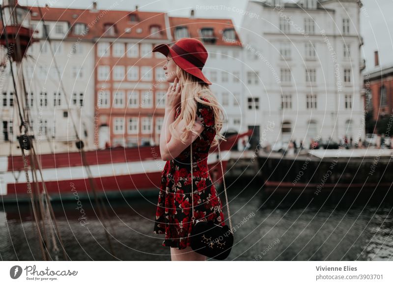 Woman Standing By The Water (Copenhagen) blonde long hair woman elegant black dress meditation relaxing nature water lake river bathe thinking thoughtful