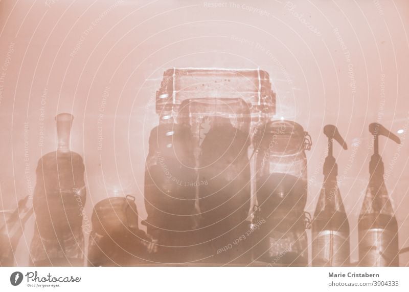 Conceptual photo showing the silhouettes of glass bottle containers to show concept of sanitation, infection control and good hygiene to fight the spread of covid-19 pandemic