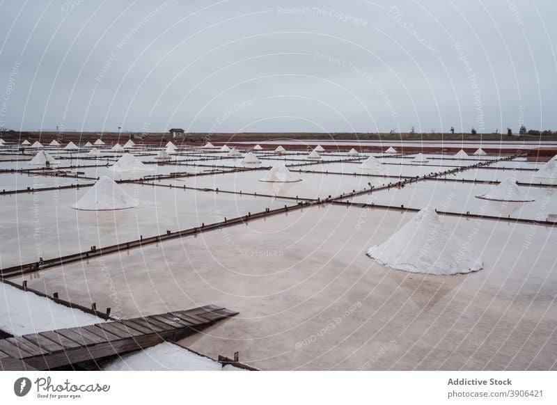 Landscape of salt ponds under cloudy sky field landscape factory harvest nature environment resource crystal farm taiwan tainan jingzaijiao asia attract tourism