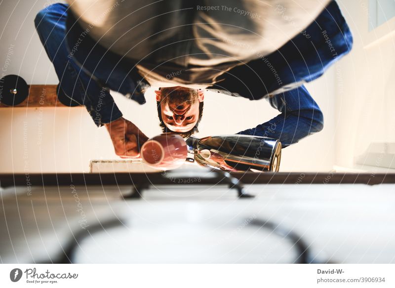 Man pours himself a coffee Coffee To have a coffee Coffee break Coffee pot Kitchen Cup Photos of everyday life Drinking Beverage Caffeine Addiction be dependent