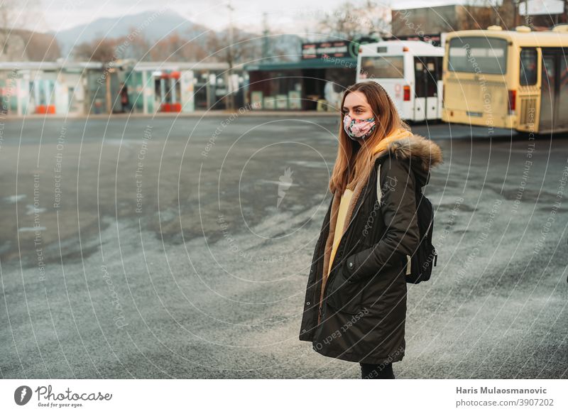 woman with face mask waiting for bus on empty station 2019-ncov auto bus bosnia bus station caution city city life corona coronavirus covid-19 detected disease