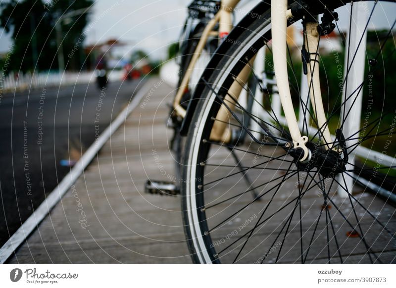 close up of bicycle wheel on side of bridge Bicycle Wheel Side Transport Cycling Day Means of transport Colour photo Parking motion active bike tire biking ride