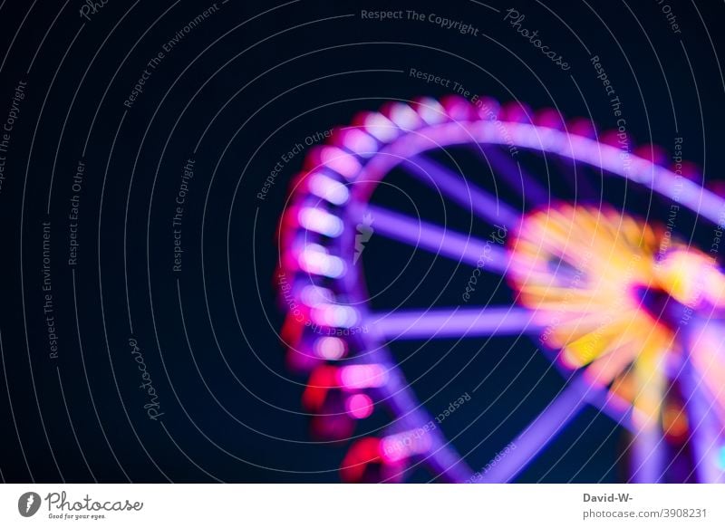 luminous Ferris wheel at night Illuminate Night clearer variegated funfair Fairs & Carnivals Rotate Movement