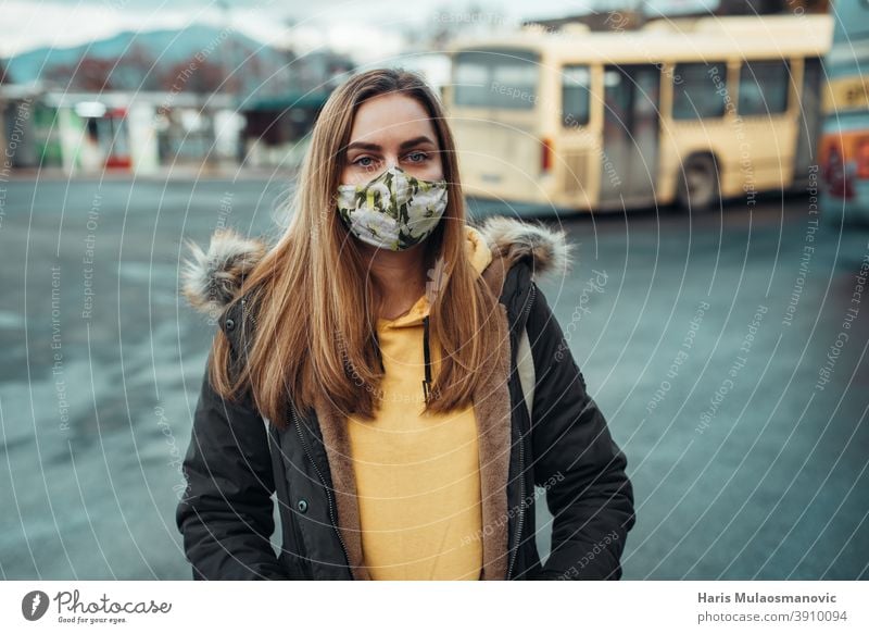 woman with face mask standing on bus station adult attractive beautiful beauty blonde business caucasian city confident coronavirus covid-19 disease e-commerce