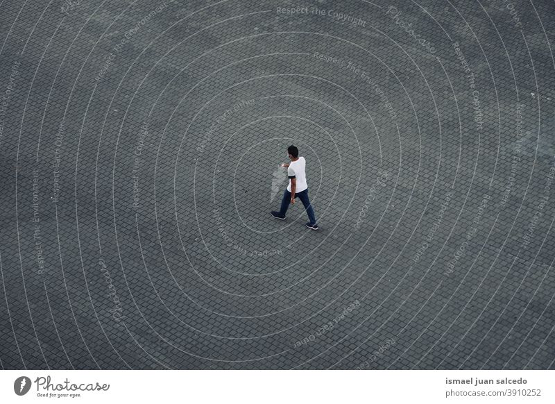 man walking on the street visiting Bilbao city Spain tourist tourism person people human pedestrian outdoors action travel destination bilbao spain