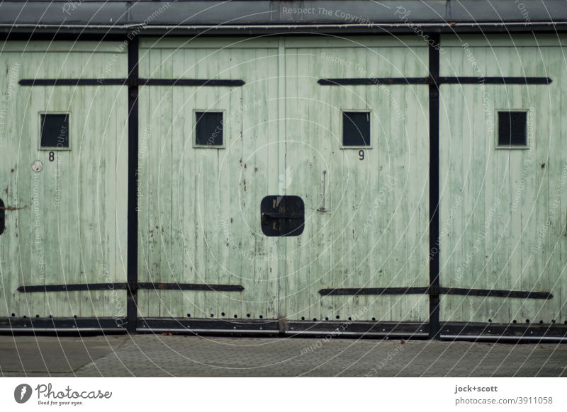 Multi-purpose garage no. 9 Garage GDR Garage door Ravages of time Prenzlauer Berg Retro Smiley Closed Sharp-edged Old Past Symmetry Weathered Style