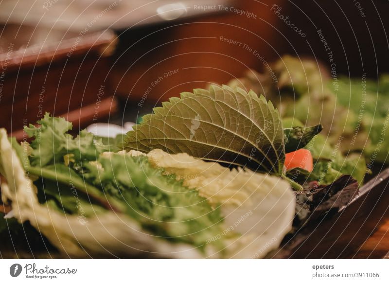 Salad plate for Bulgogi meal in a restaurant in Seoul, South Korea salad korea korean south bulgogi seoul greens vegetables food lettuce close up