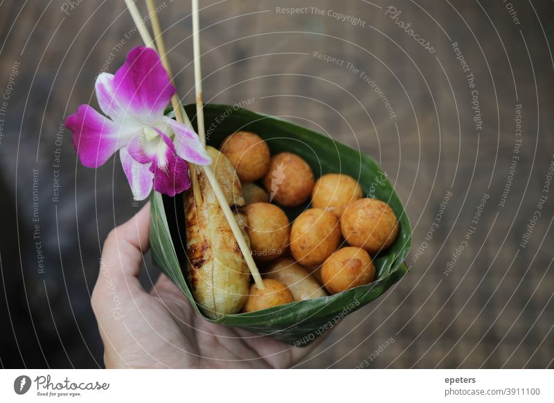 Street food in Thailand street food thailand banana blossom hand holding food Bangkok