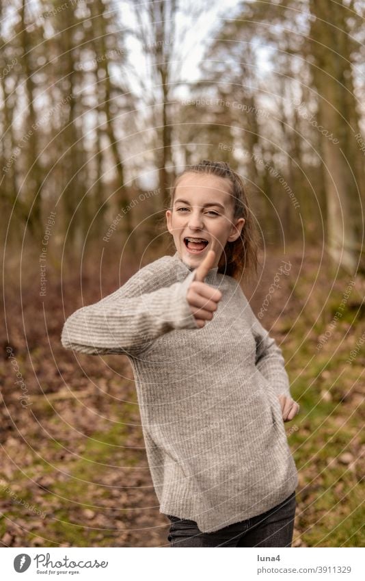 happy girl with braces shows thumbs up Girl Braces Thumbs up Brooch Success Tall Sieg confident Youth (Young adults) Laughter optimistic contented relaxed