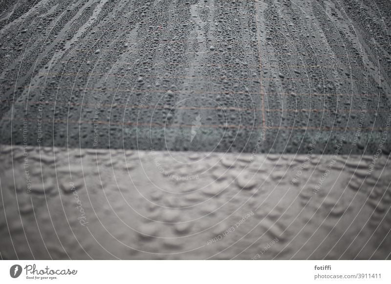 Drops like sand on the sea Rain raindrops car Wet Drops of water Weather Detail Bad weather Deserted Autumn Gray Exterior shot Car Window Window pane