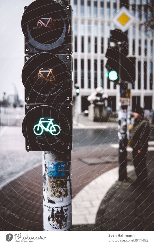 Man waits at traffic light Traffic light Green Wait Transport Road sign Road traffic Colour photo Exterior shot Traffic infrastructure Street Lanes & trails Day