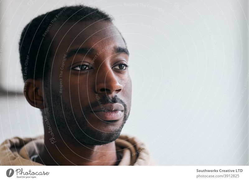 Portrait Of Unhappy Young Man With Mental Health Issues At Home man unhappy sad depressed depression anxiety anxious mental health wellbeing lonely loneliness