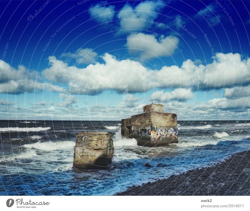 Old bunker Dugout Wehrmacht Concrete Monument Sign Historic Second World War German past Part Derelict coast Weather Horizon Sky Clouds Water Exterior shot