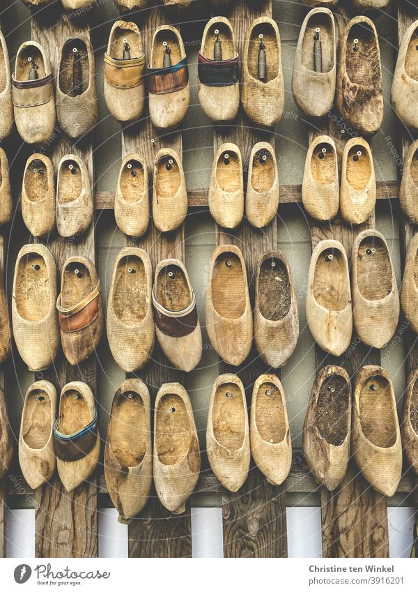 zeitgeschichte | These old lumps of wood have certainly experienced a lot... Now they hang decoratively on a wall Wooden shoes Clogs Munsterlander lump of wood